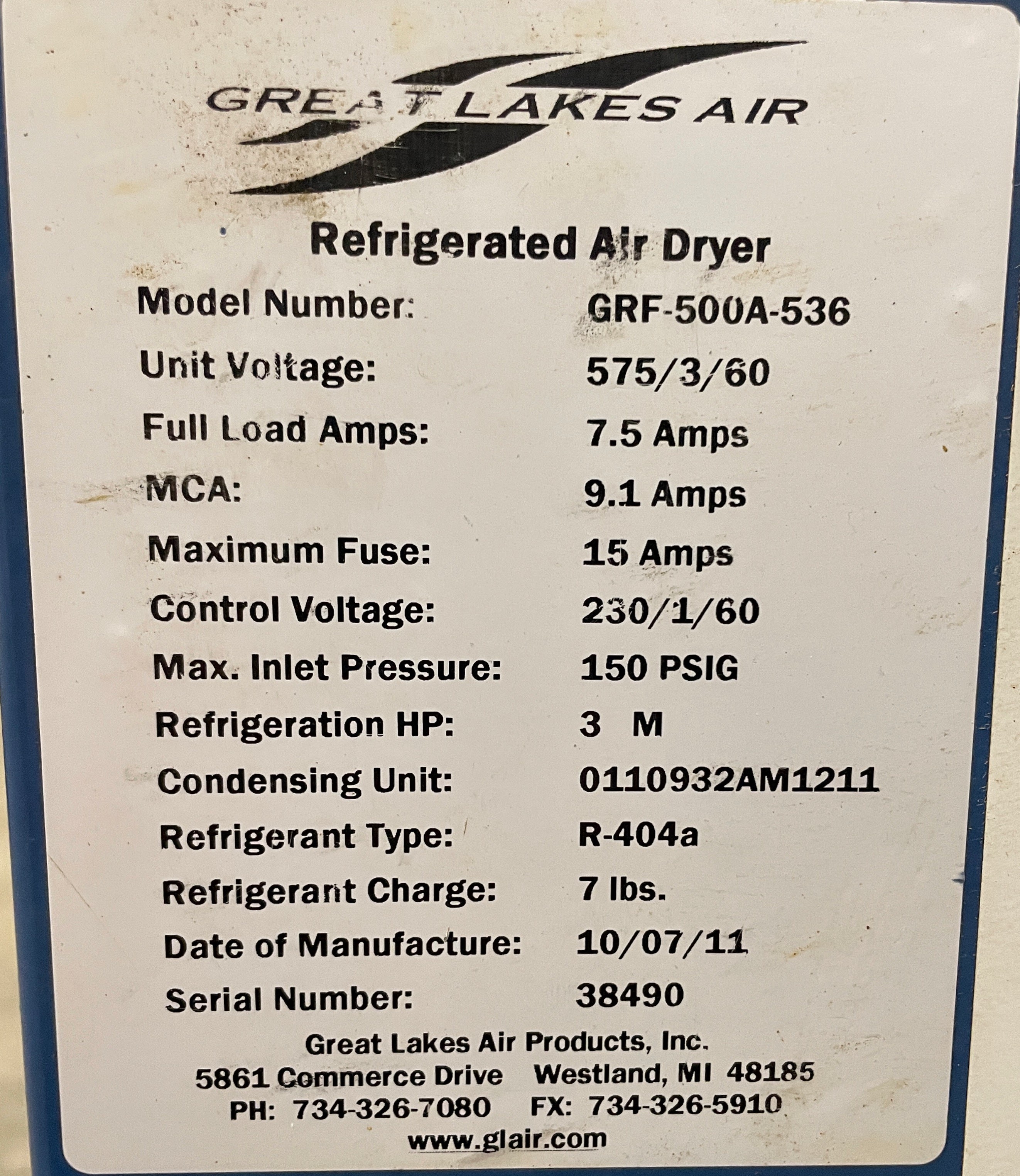 Label on a Great Lakes Air refrigerated air dryer shows model, electrical specs, refrigerant type (R-404a), capacity, manufacturing date (10/07/11), and serial number.